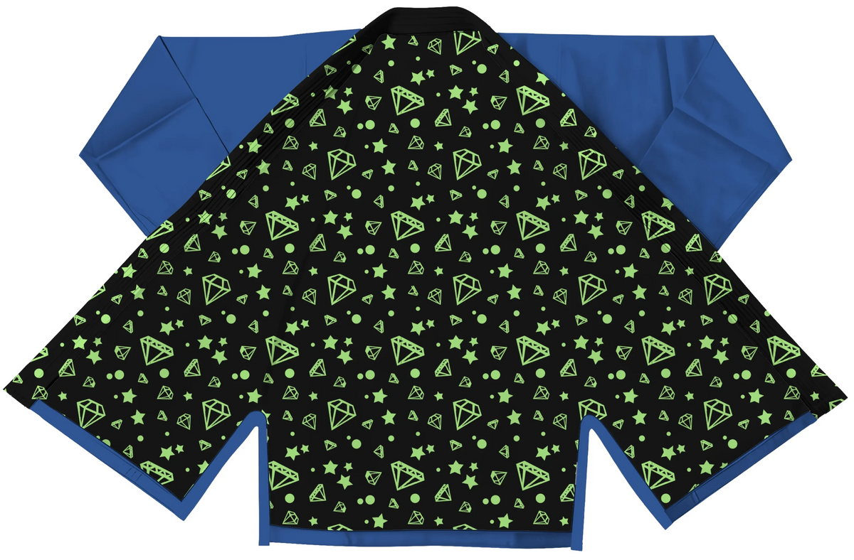 Ladies blue gi shown in academy setting with white belt and clean branding