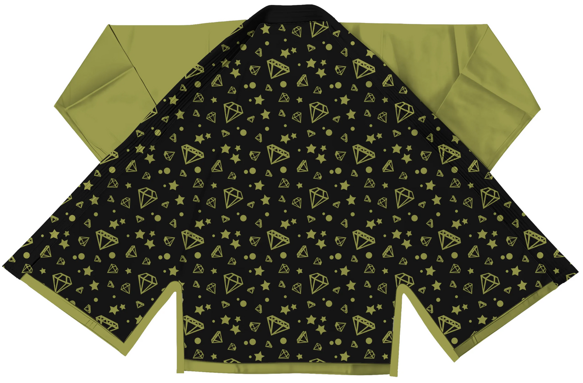 Tailored green gi for ladies displayed with pearl weave jacket and tapered sleeve design