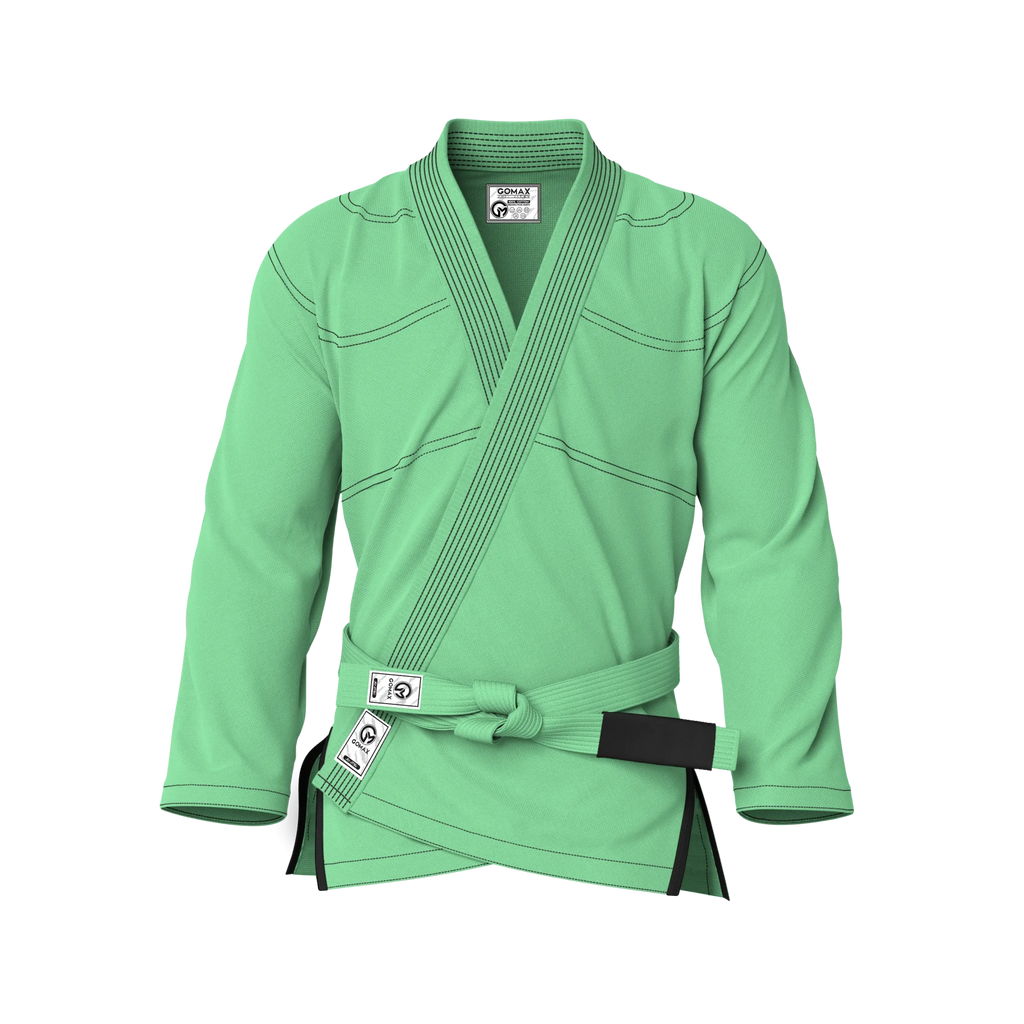 Front view of green gi for youth classes showing reinforced stitching and fit for junior belts and kids’ programs.