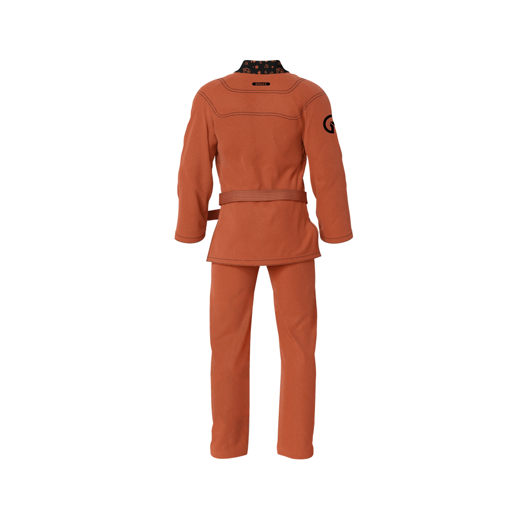 Orange gi for beginners shown in martial arts class with youth grapplers