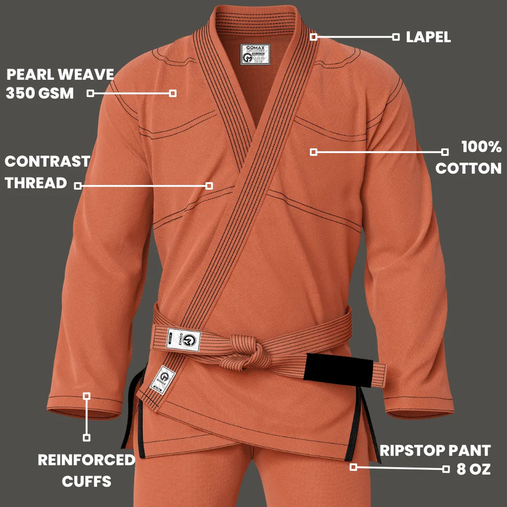Orange jiu jitsu gi worn by male athlete in martial arts gym